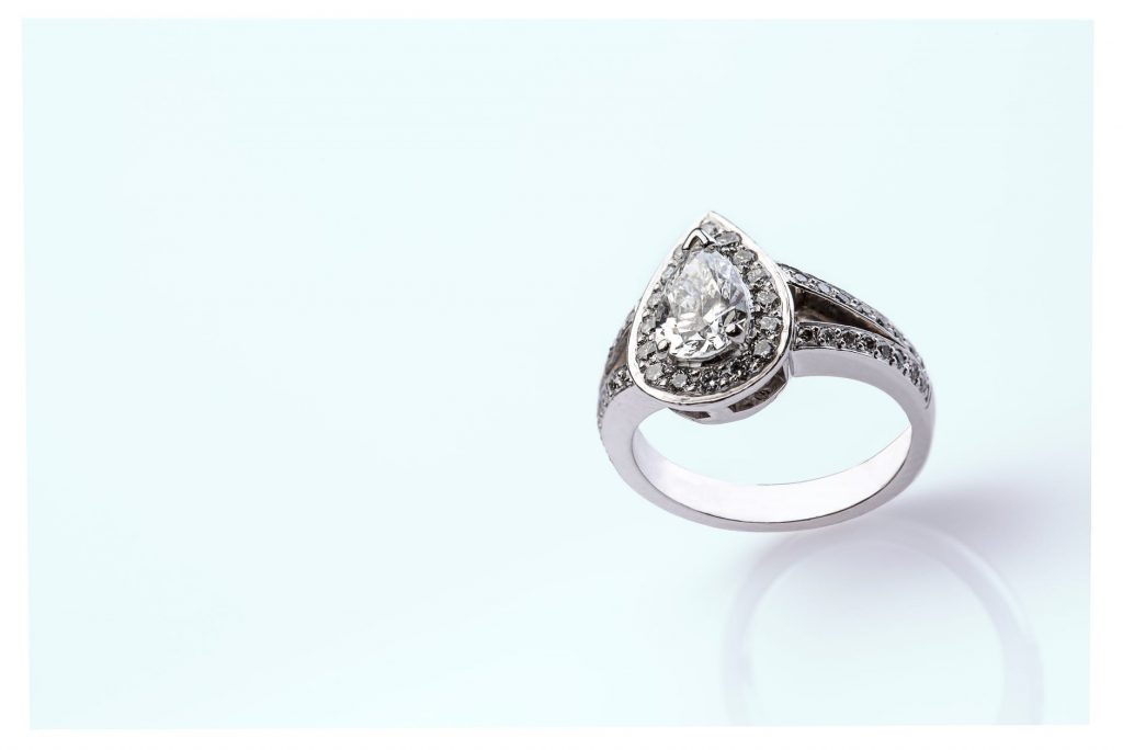 An engagement ring with a pear-shaped diamond stone