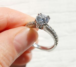 A diamond ring with a cathedral setting