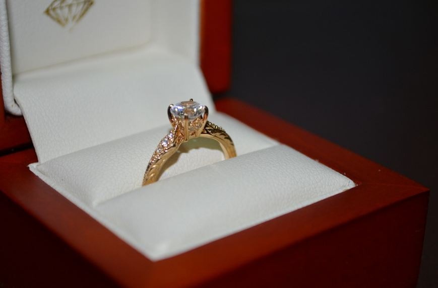 engagement ring with gold band and diamond center piece