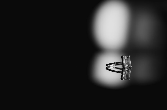 A black and white photo of a diamond ring