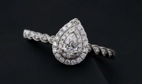 Pear-shaped diamond engagement ring with a double halo