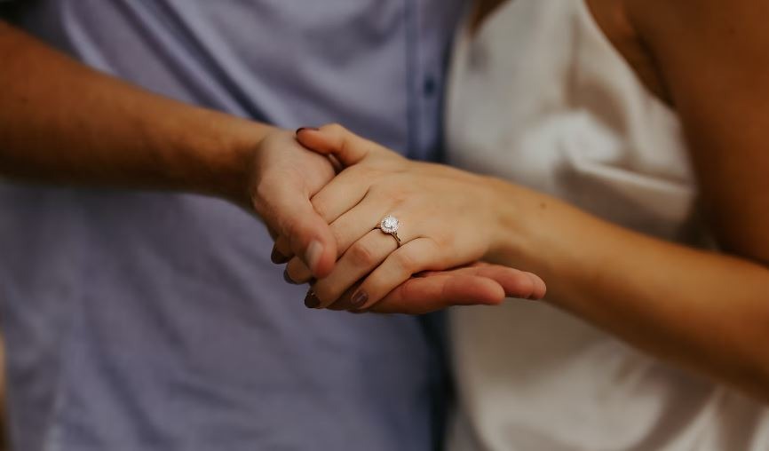 engagement ring on the left hand